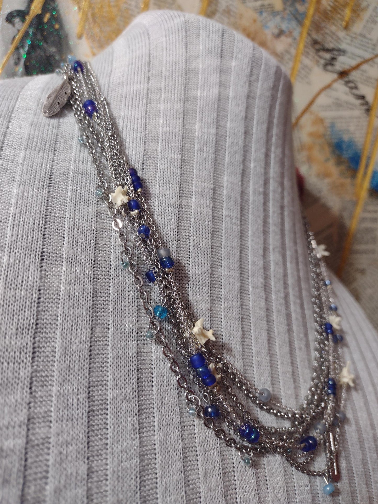Native Southwest Stainless Steele Chain Necklace. Rattlesnake vertebra, cobalt glass, and silver feathers. New Mexico Crafted.